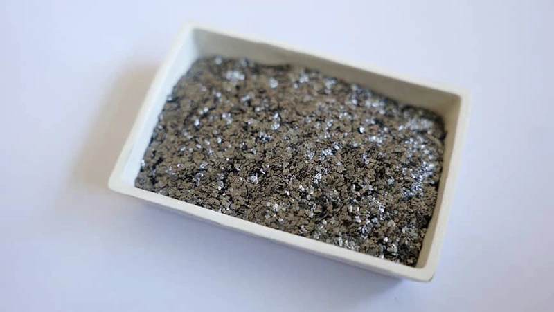 Flake graphite and spherical graphite are two common graphite products with significantly different properties. Flake graphite is derived directly from natural ore and retains its original flaky crystal structure, whereas spherical graphite is produced from flake graphite through further processing to alter the particle morphology. This article will introduce the characteristics and typical applications of these two products. Flake graphite possesses a natural flaky structure, with irregularly shaped particles characterized by a high aspect ratio. Its advantages include high-temperature resistance, excellent electrical and thermal conductivity, and chemical stability. Key technical indicators include fixed carbon content and mesh size (particle size). In terms of applications, flake graphite is widely used in refractory materials (such as magnesia-carbon bricks and crucibles), brake pads and friction materials, casting coatings, and as a raw material for producing spherical graphite. Our annual production capacity for flake graphite exceeds 120,000 tons, covering a wide range of specifications from 32 mesh to 325 mesh. Spherical graphite is a product manufactured from high-purity flake graphite through processes of pulverization, shaping, and precision classification. Its particles are ellipsoidal to spherical in shape, with smooth surfaces. Key performance indicators include tapped density (&ge;1.0 g/cm&sup3;), specific surface area (&le;5 m&sup2;/g), and particle size distribution D50 (typically 15&ndash;20 &mu;m). In terms of applications, spherical graphite is a key raw material for lithium-ion battery anodes and is also used in high-end conductive materials and specialty carbon products. Our annual production capacity for spherical graphite exceeds 60,000 metric tons, primarily serving the new energy vehicle and energy storage battery industries. Flake graphite and spherical graphite share the same origin but differ in form. Flake graphite is a basic product used directly in traditional industries, while spherical graphite is a value-added product derived from flake graphite, serving the new energy sector. As a manufacturer producing both products, we possess a complete industrial chain spanning from ore to flake graphite and on to spherical graphite.